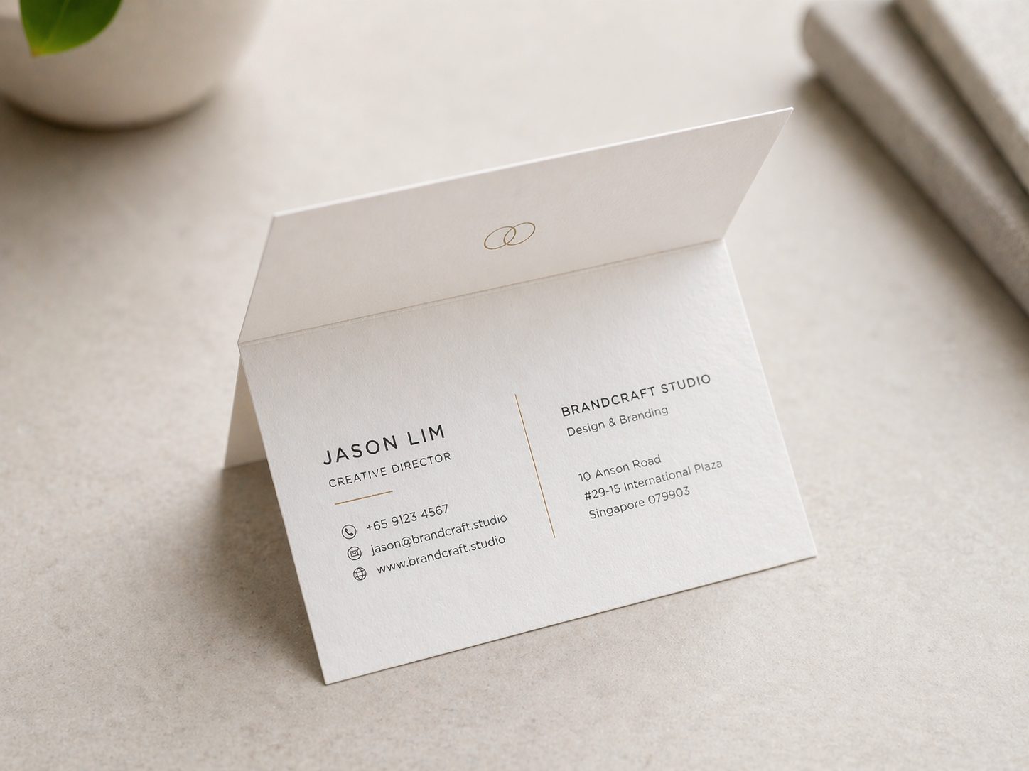 Folded business card opened to show inner panel print