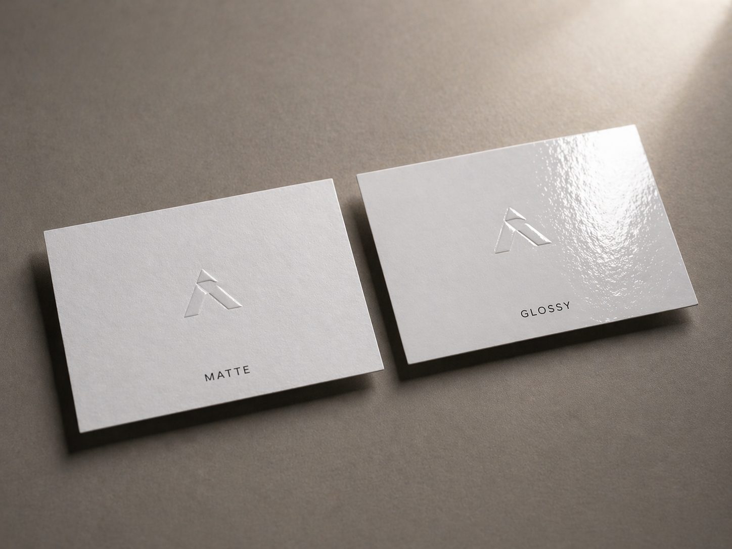 Matte and glossy business card finishes compared side by side