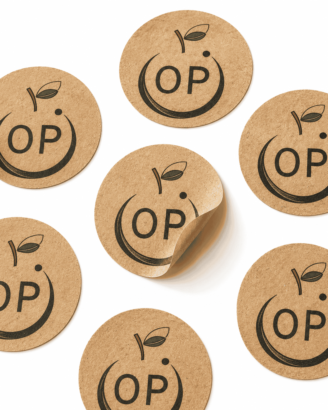 Round kraft paper stickers in natural brown stock — printed digitally by Orange Print Singapore with black-ink OP logo