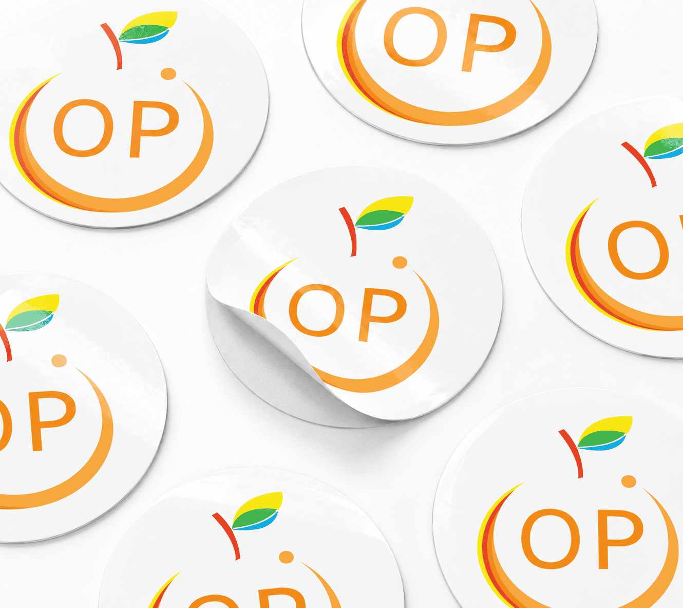 Round paper stickers in glossy white mirrorkote with Orange Print logo, custom printed in Singapore