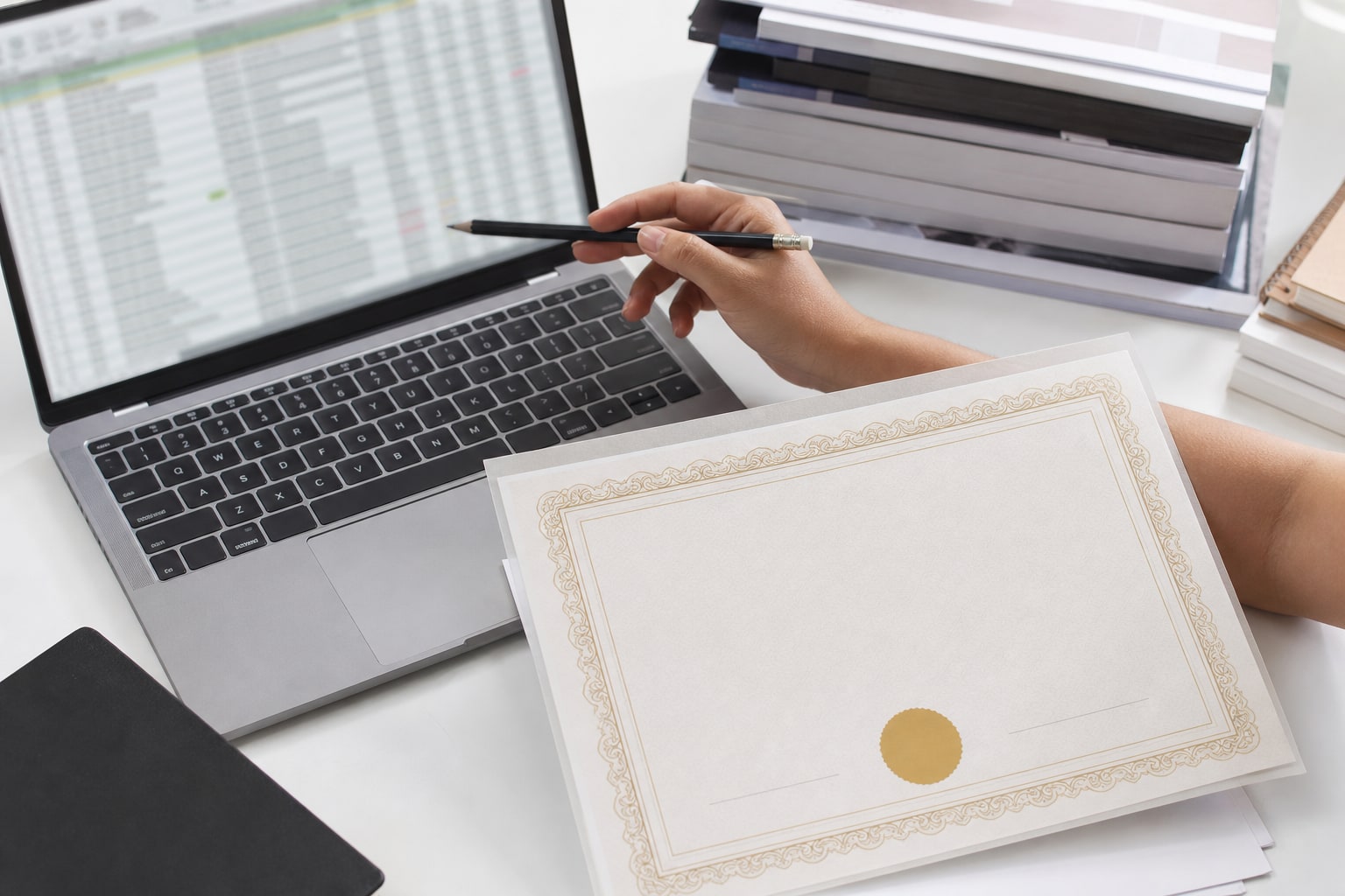 Certificate proof checked against a participant name spreadsheet before printing