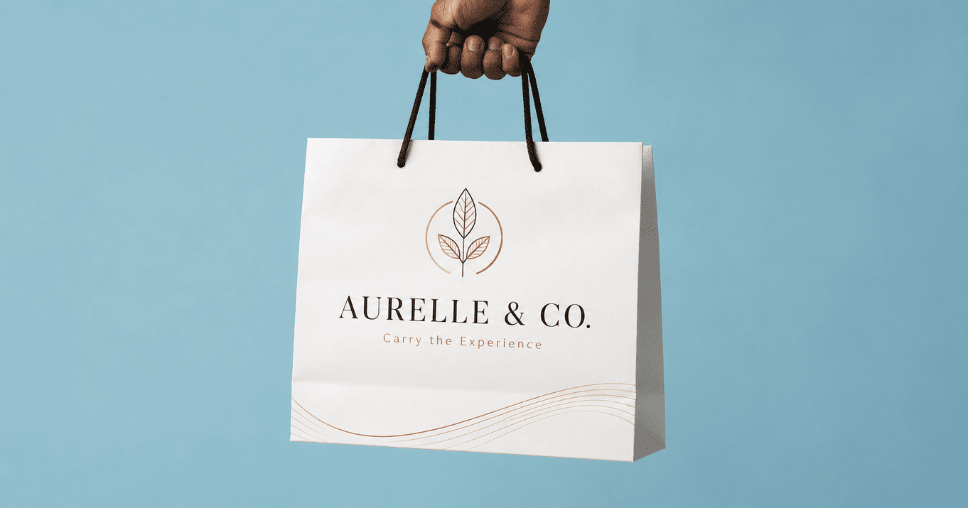 Custom paper bag printing services in Singapore featuring a white luxury paper shopping bag with gold foil branding and rope handles held against a clean blue background.